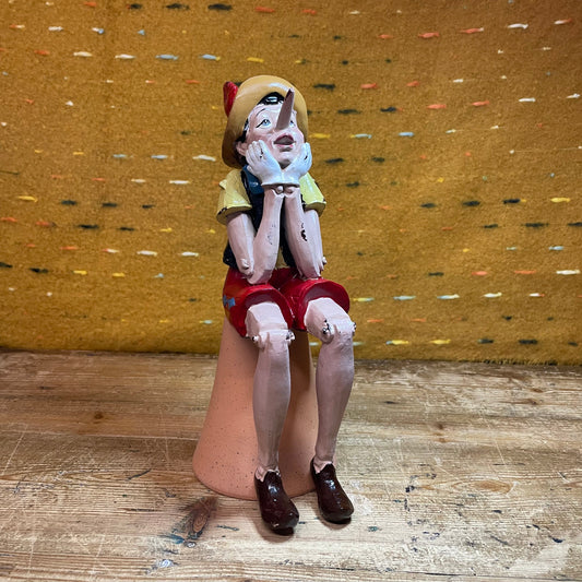 Antiqued Sitting Pinocchio Figure